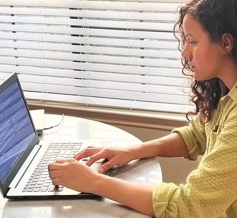 Jamie Ramirez working at laptop